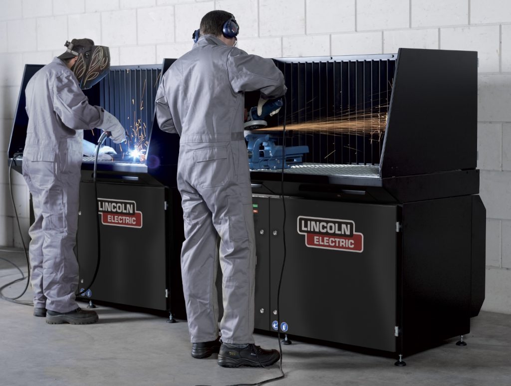 DownFlex Table with workers welding and grinding